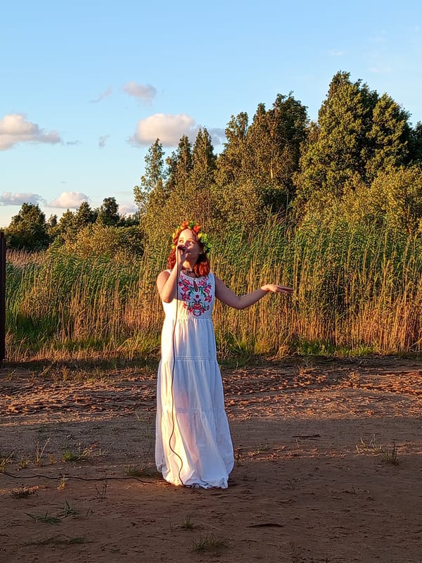 Folk holiday celebration with dancing, flowers, and live music in rural Russia