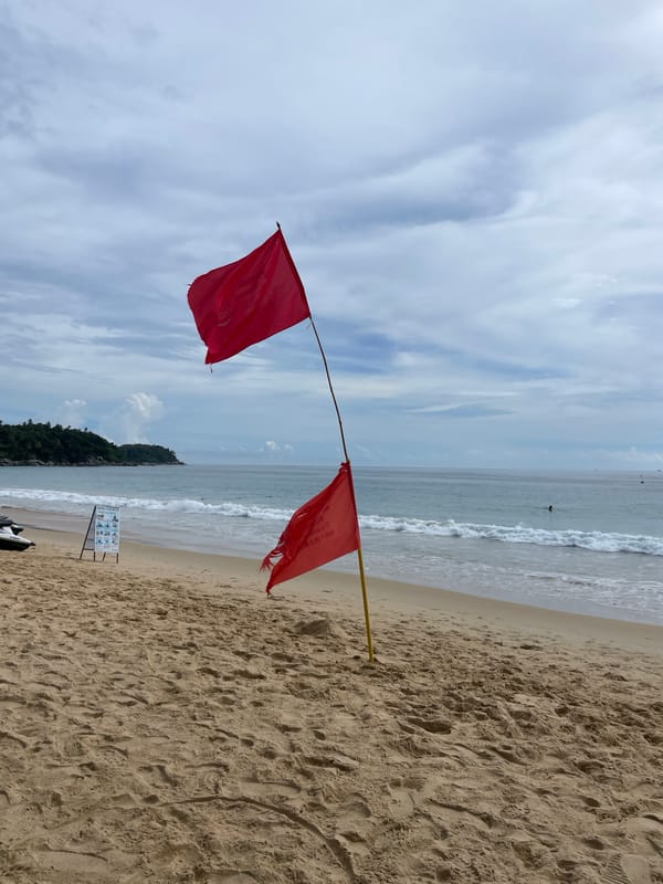 Karon Beach scenes show red flags, inflatables, vendors