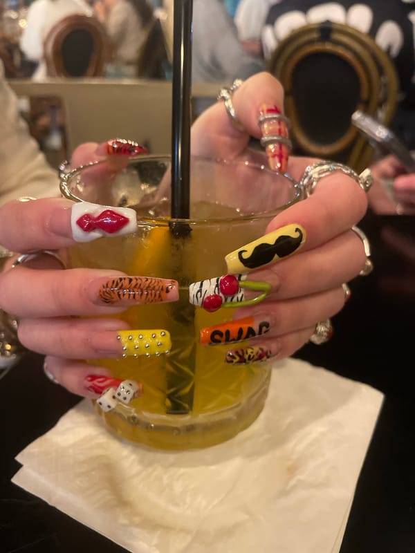 Woman shows off mustache nail art at Raanana restaurant