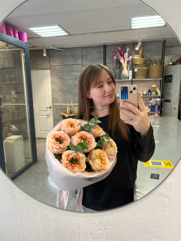 Woman takes selfies with baby on snowy Chaikovsky street