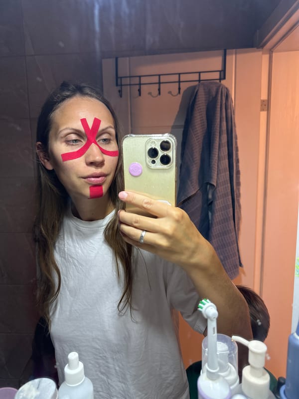 Woman applies kinesiology tape, uses light therapy device in Fethiye