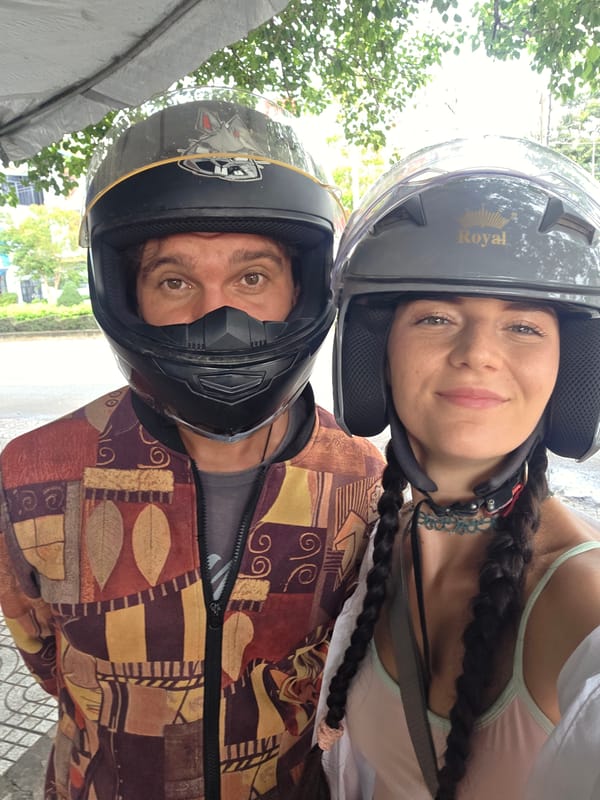 Tourists pose at Vietnam durian stand during morning visit