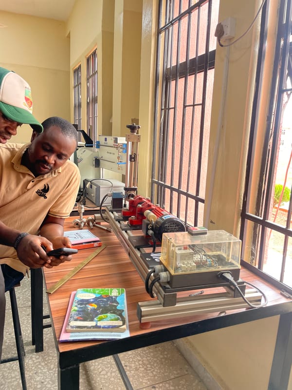Scientific demonstration with polariscope held in Afaka classroom