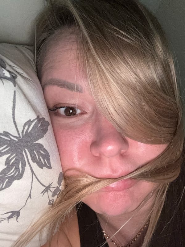 Woman rests on floral pillow in Izhevsk apartment