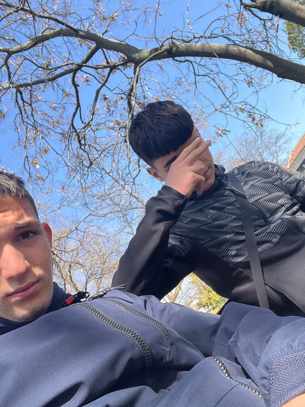 Two young men enjoy sunny afternoon in Saedinenie park