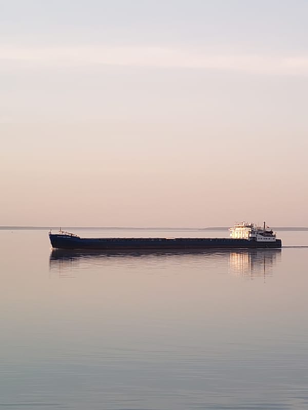 Cargo ship spotted on calm waters near Gorokhovo, Russia