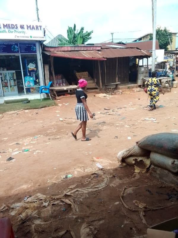 Morning street life and market activity in Nkpor, Nigeria