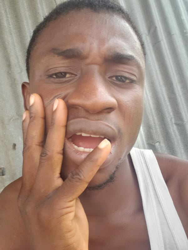 Man poses for multiple photos on Adankolo streets