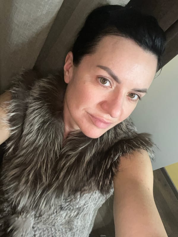 Evening domestic scenes in Belgrade home with woman and dog