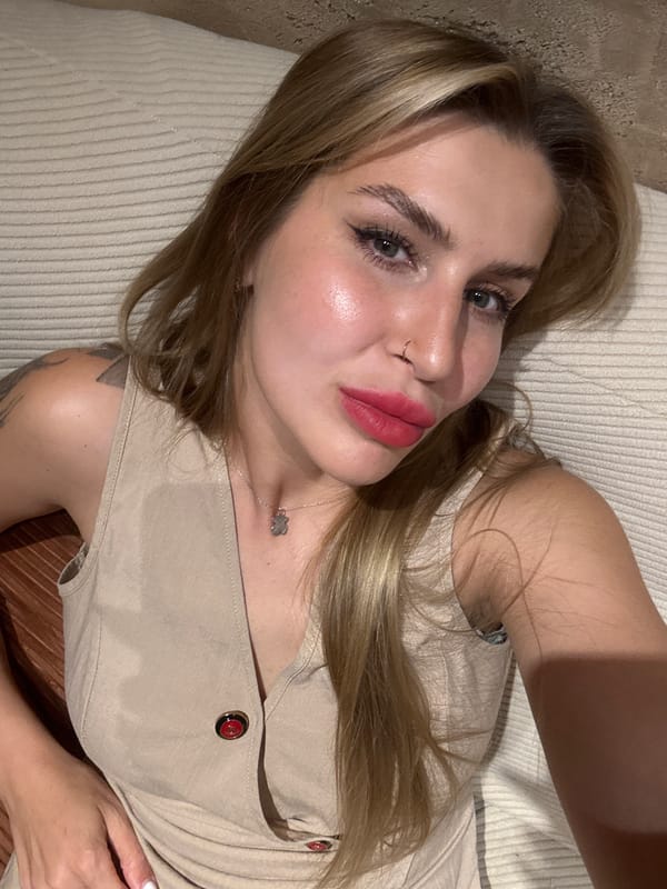 Woman in beige dress observed resting in Bijela, Montenegro