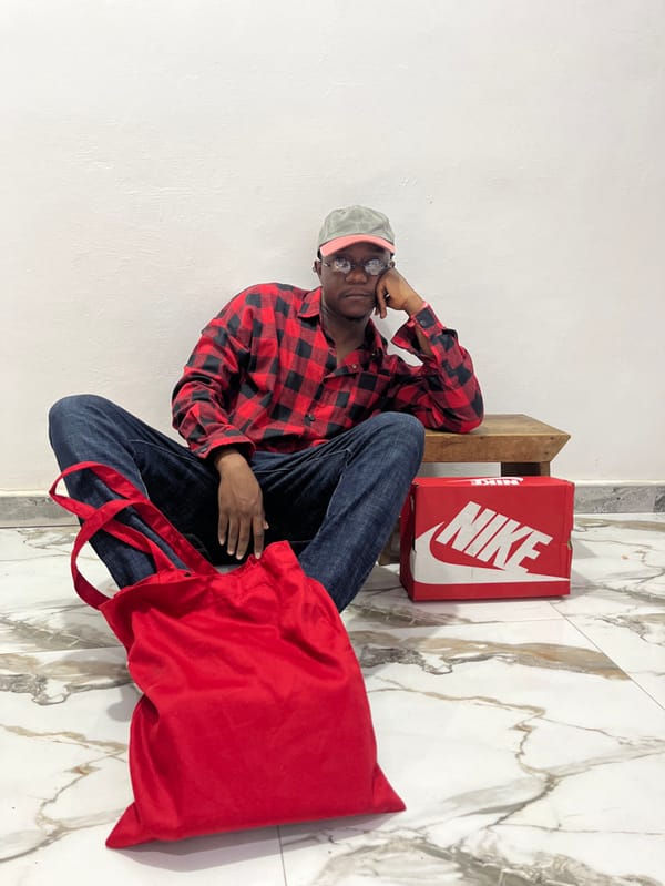 Person conducts photo session with various outfits in Ghana