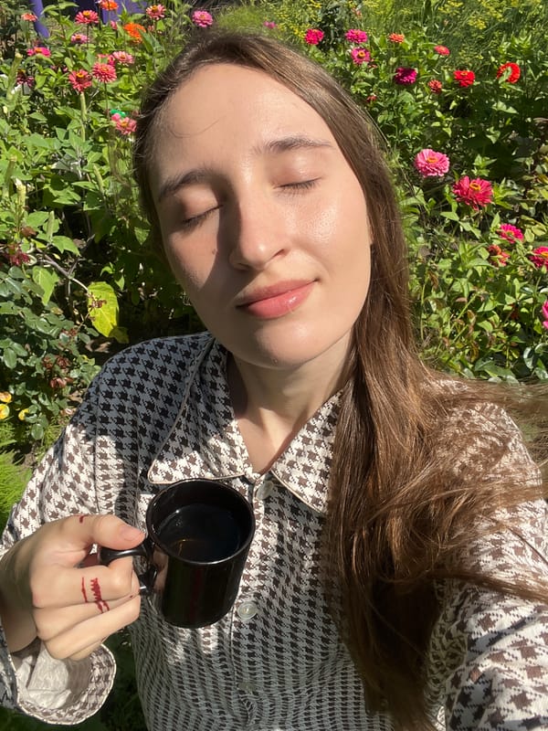 Coffee and a cat in the garden on a slow morning