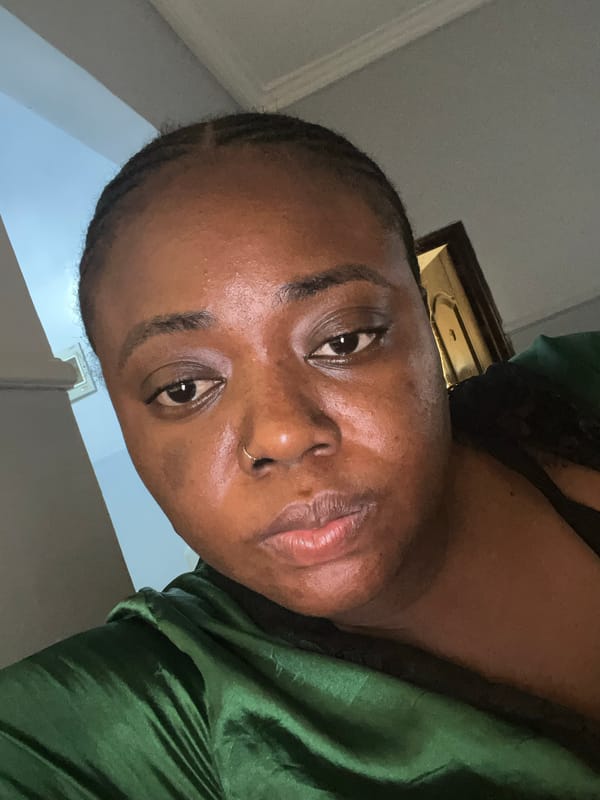 Person takes morning selfies in green outfit, Kubwa Nigeria