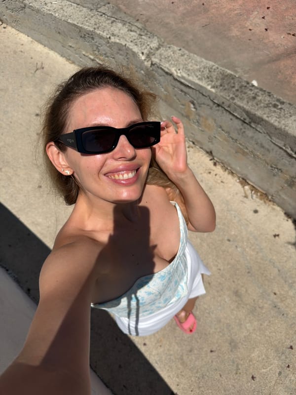 Woman documents morning activities through selfies in Budva, Montenegro
