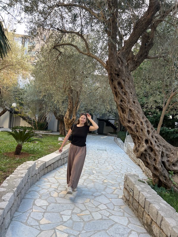 Woman sunbathes on Montenegro coast amid clear skies