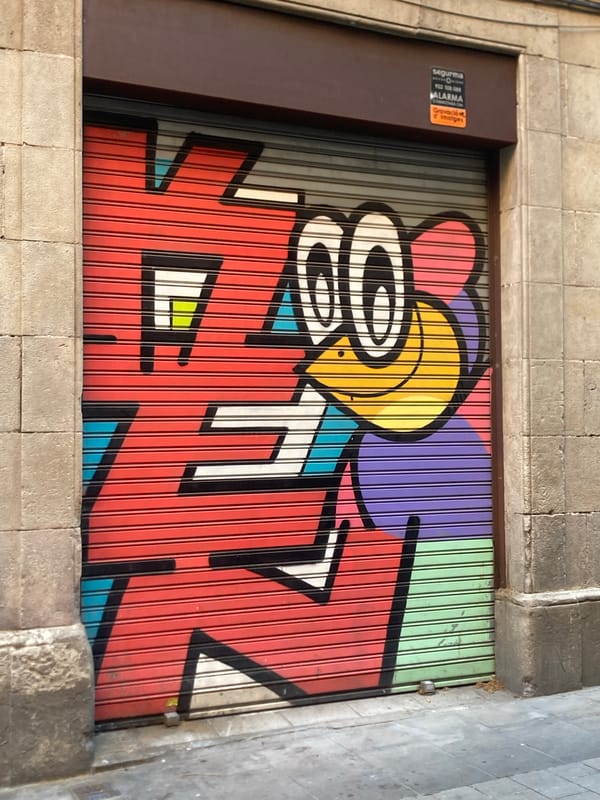 Barcelona street art and historic facades on a summer afternoon