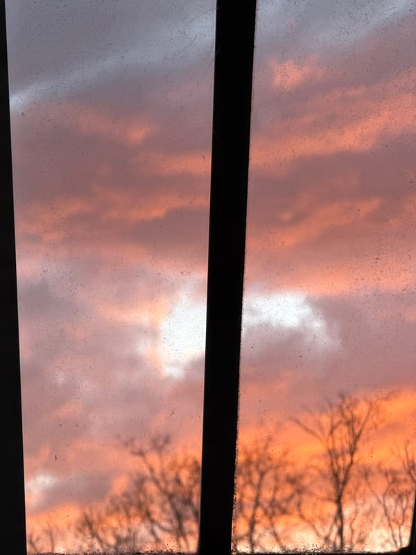 Sunset viewed through wooden window in London
