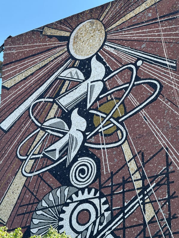Bold Soviet-era style mosaic mural on a Lovech building wall