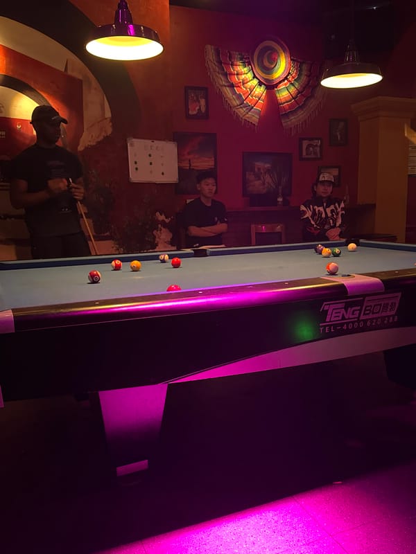 Man plays pool at decorated venue in Chenghua District
