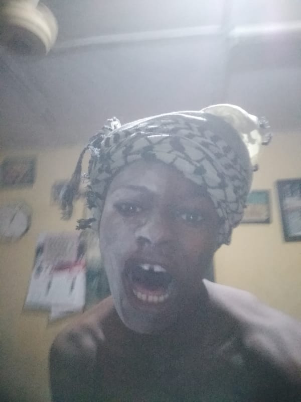 Person applies face mask in Shangisha home