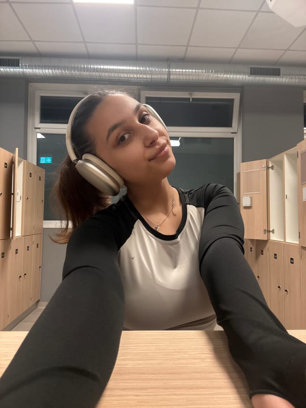 Woman takes mirror selfies in gym locker room