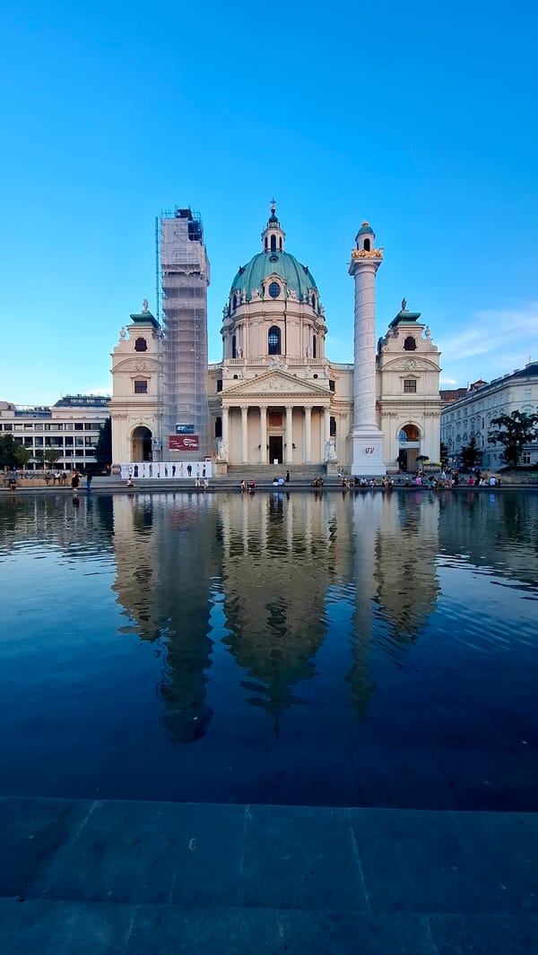 Baroque architecture and a street band near Karlsplatz, Vienna