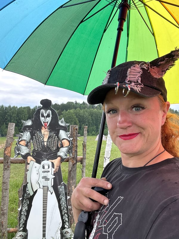 Woman and KISS cutout photographed in Russian village