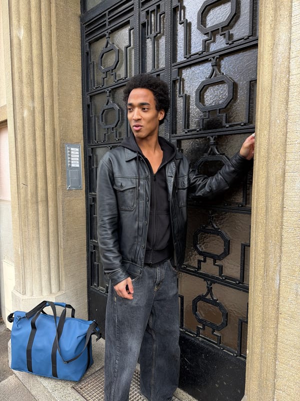 Young man stands outside ornate building in Strasbourg