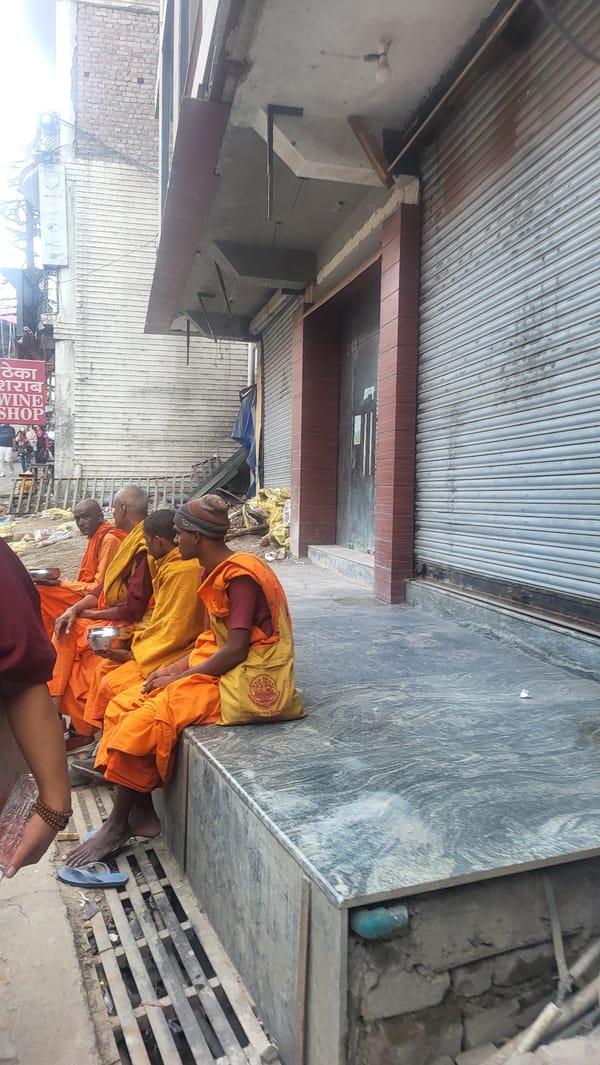 Buddhist monks observed in early morning street scenes in Dharamshala