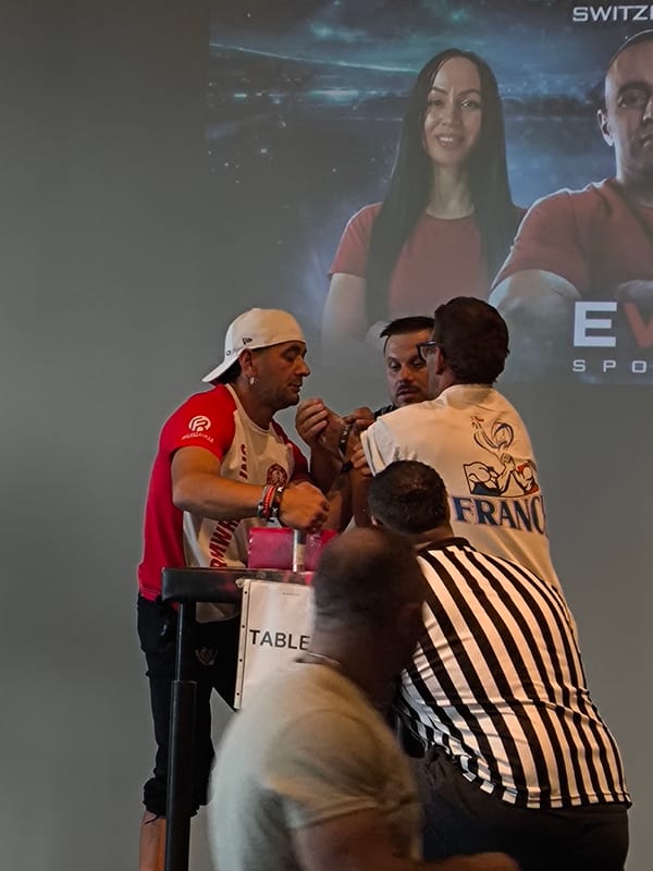 Arm wrestling tournament with matches and medal ceremonies