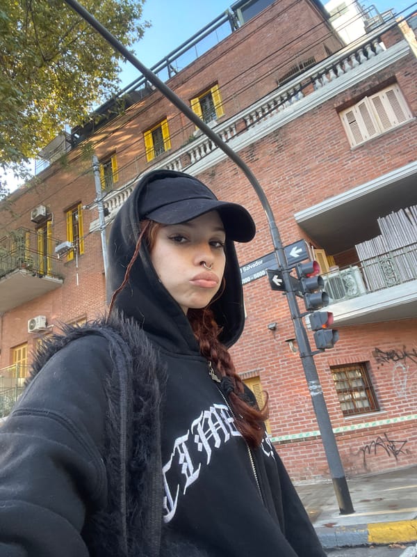 Young person photographed on busy Buenos Aires street corner