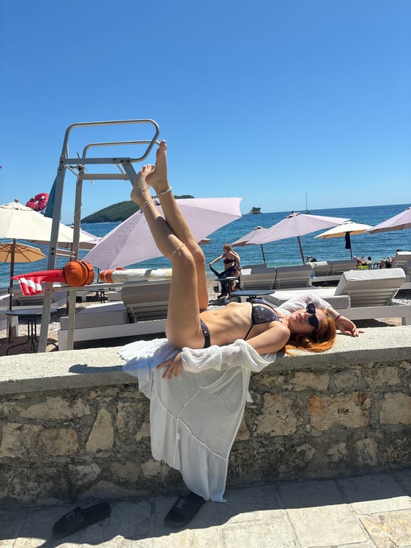 Woman poses for beach photos across Budva waterfront