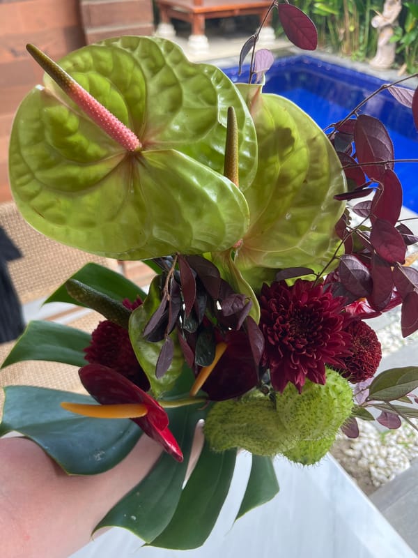 Tropical flower arrangement documented across Bali locations