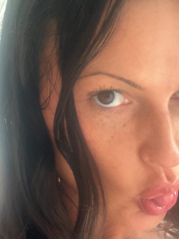 Woman rests on couch in Wealden home