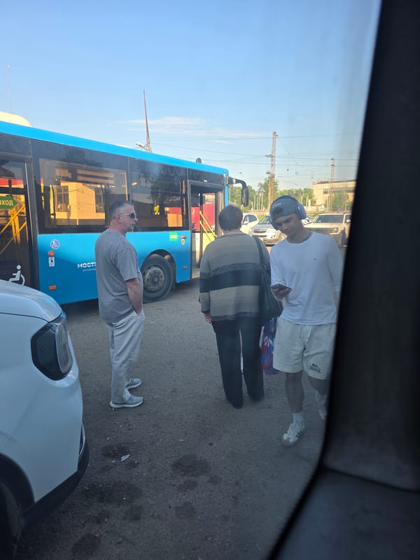 Bus with Cyrillic markings spotted at city transit stop