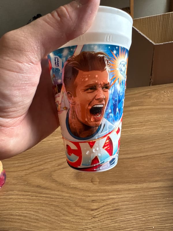 Condensation-covered cup with face print held in Tbilisi