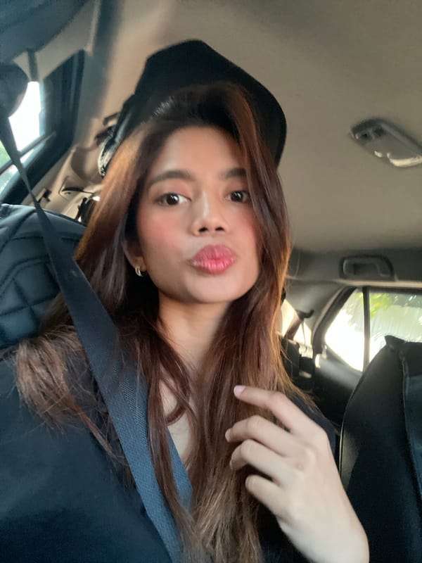 Young woman takes selfies in car, Davao City
