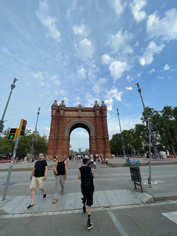 Crowd with flags assembles near Arc de Triomf, Barcelona