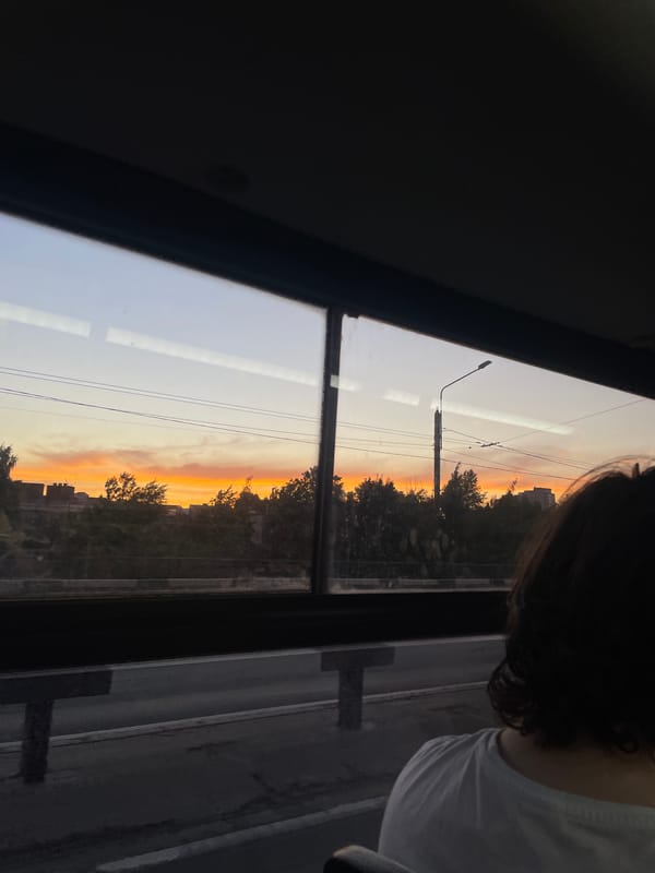 Vibrant sunset observed over Saint Petersburg skyline from vehicle