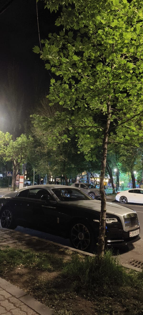 Luxury cars including Rolls Royce spotted on nighttime city street