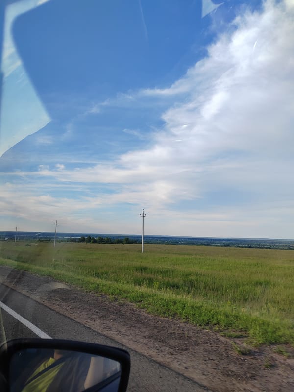 Rural countryside journey documented through 26 vehicle-view memories