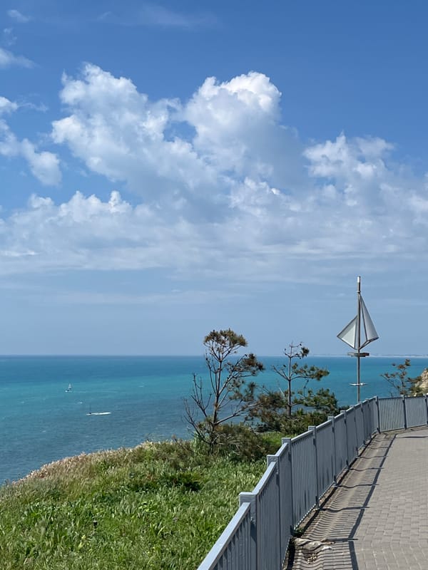 Elderly hiker enjoys sunny morning on Anapa seaside promenade