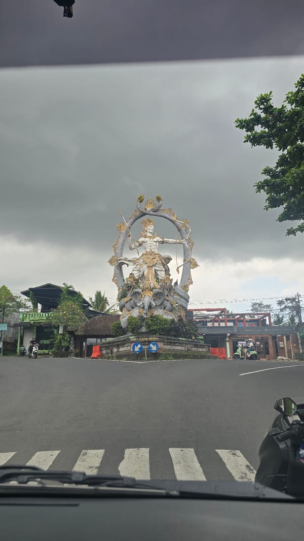 Hindu deity statue observed at Ubud roundabout intersection