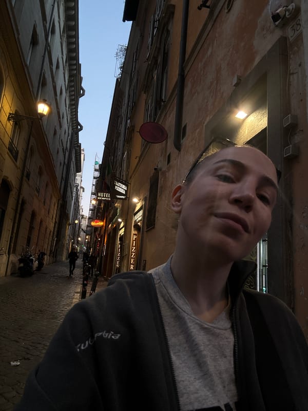 Busy Rome street scenes captured near arched tunnel