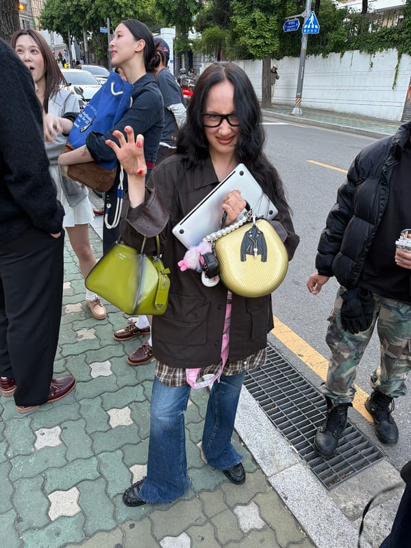 Seoul street scenes: woman with laptop, shoes on display