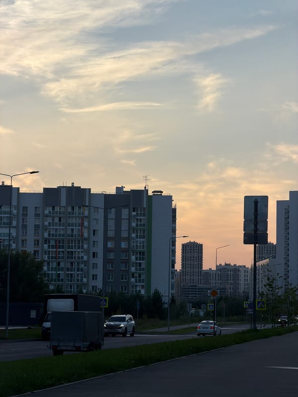 Urban apartment blocks and a vivid dusk sky at day's end