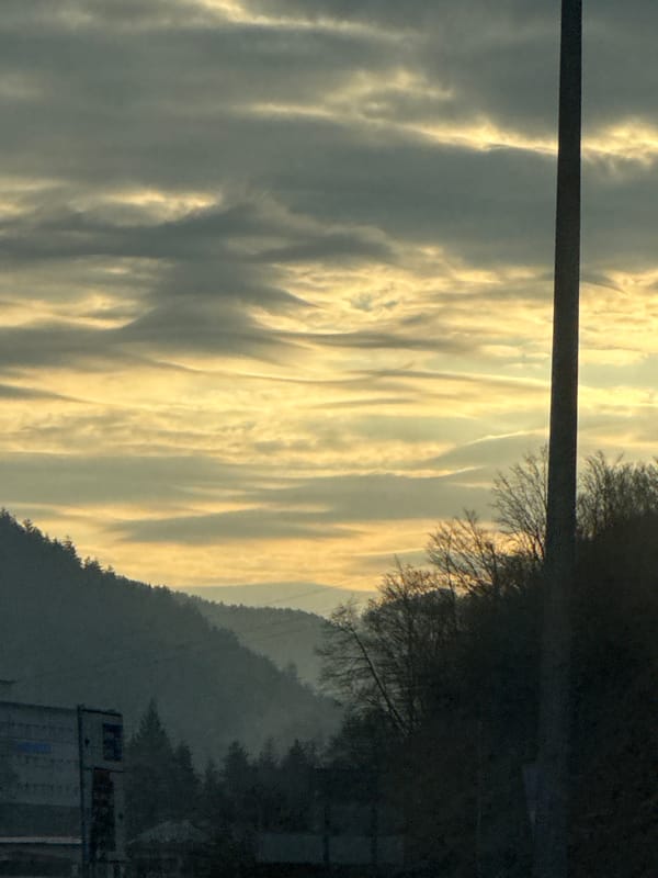 Golden striated clouds photographed during dawn in Smolyan, Bulgaria