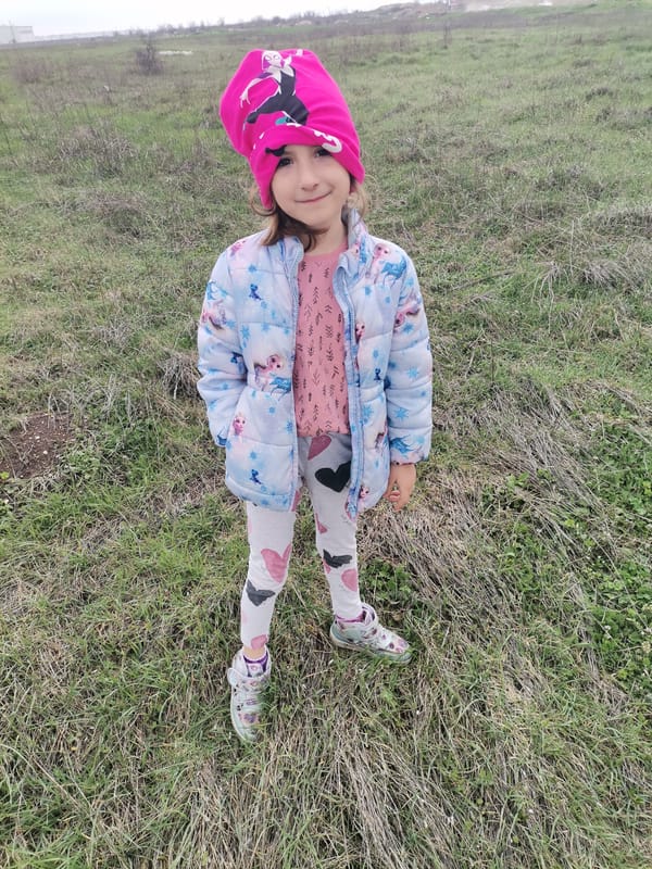 Child in superhero hat spotted in Bulgarian field