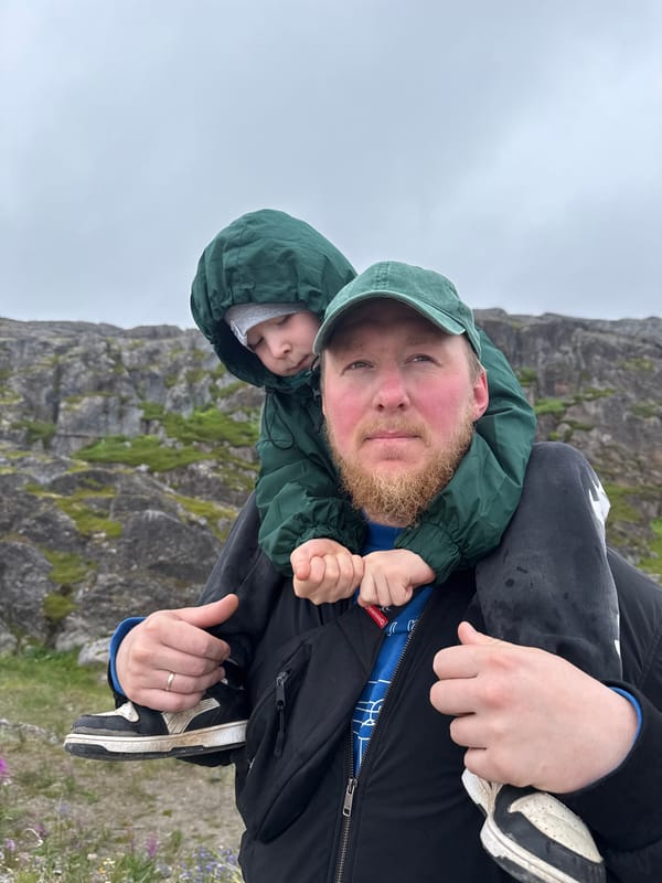 Exploring Teriberka's rocky Arctic coastline on a grey day