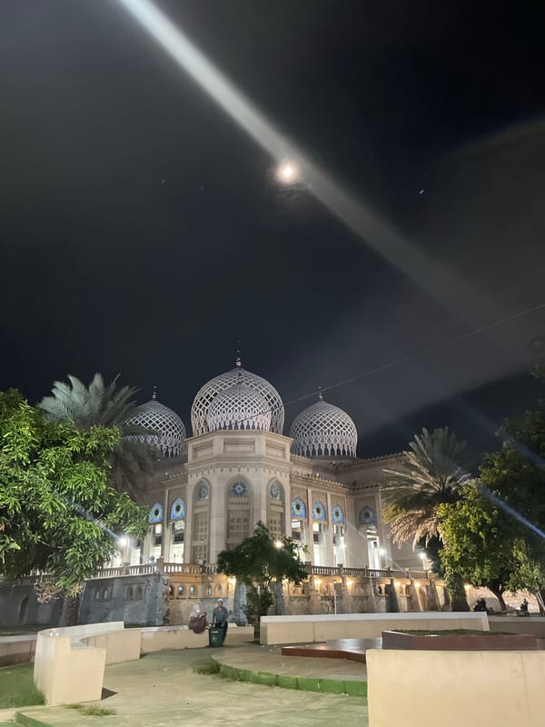 Baiturrahman Grand Mosque glowing at night in Lhokseumawe
